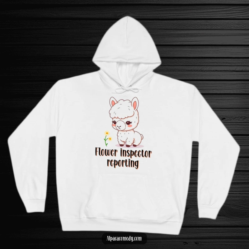Funny kawaii alpaca with a magnifying glass curiously inspects a tiny daisy, printed on a soft hoodie, radiating warmth and playful curiosity.