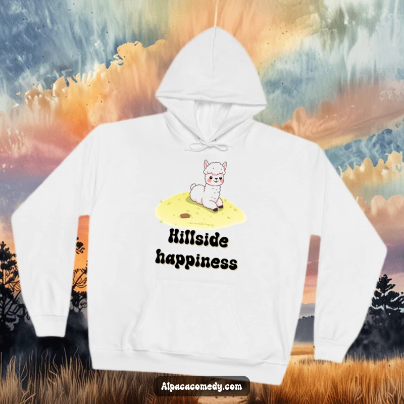 Funny kawaii alpaca joyfully slides down a gentle grassy hill, printed on a soft hoodie, radiating warmth and playful energy.