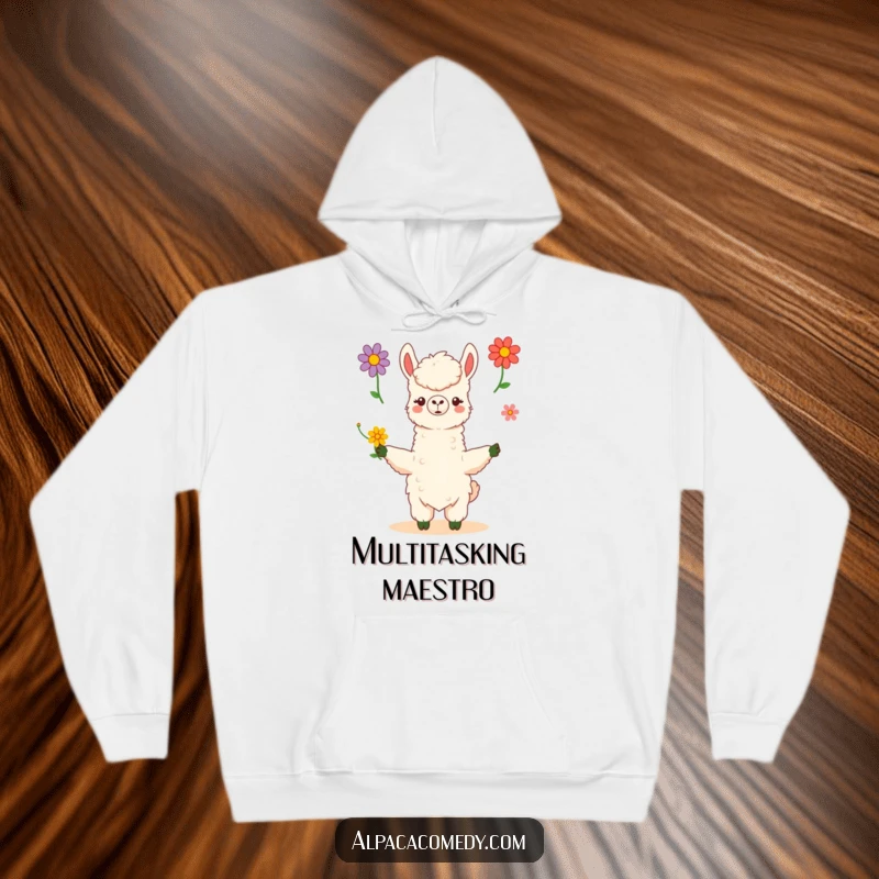 Funny kawaii alpaca skillfully juggles three vibrant flowers with poise and grace, featured on a soft hoodie, radiating warmth and creativity.