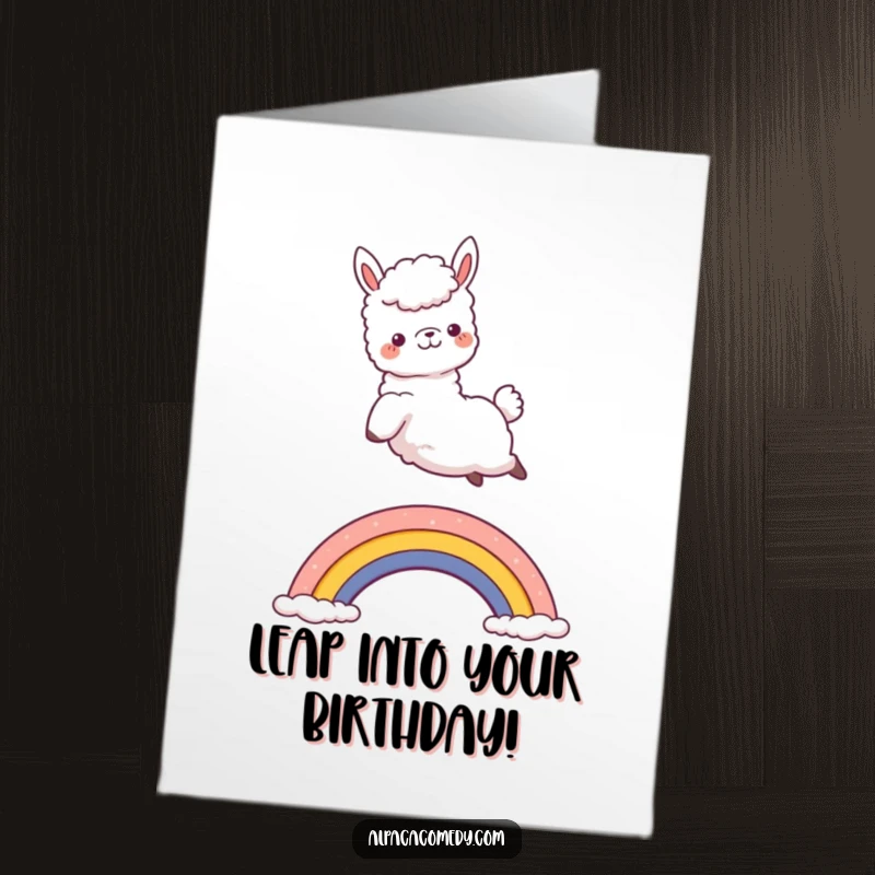 Funny Free Printable Birthday Card: Kawaii alpaca joyfully jumping over a small rainbow, full of birthday cheer, downloadable.